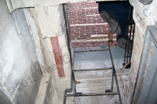 The chimney is accessible by stairs and ladder through a hatch to an area where scaffolding may be installed.
