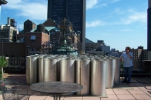 Delivery of stainless steel chimney liner sections on the roof. Aren't they beautiful? © 2013 IntelliGreen Partners, LLC