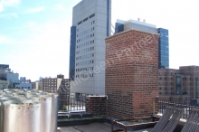 Delivery of stainless steel chimney liner sections on the roof.