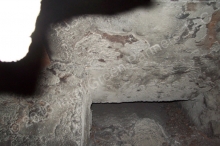 The base of the chimney, where installer must start the chimney liner, is behind this structure. The chimney has never been cleaned at this point and is filled with soot.