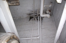 This is what it looked like from inside the Boiler Room. The wall opening to vent new make-up air louver unit is above the old boiler on east wall.