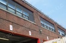 LL87/09 energy auditor notes that the owner of this warehouse is saving money by adding light sensors to his exterior lights which used to be on 24/7.  © 2015 IntelliGreen Partners LLC