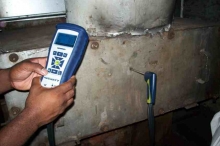 LL87/09 energy auditor will use a combustion analyzer to test the boiler's combustion efficiency and make recommendations to reduce heat losses and save money.  © 2015 IntelliGreen Partners LLC